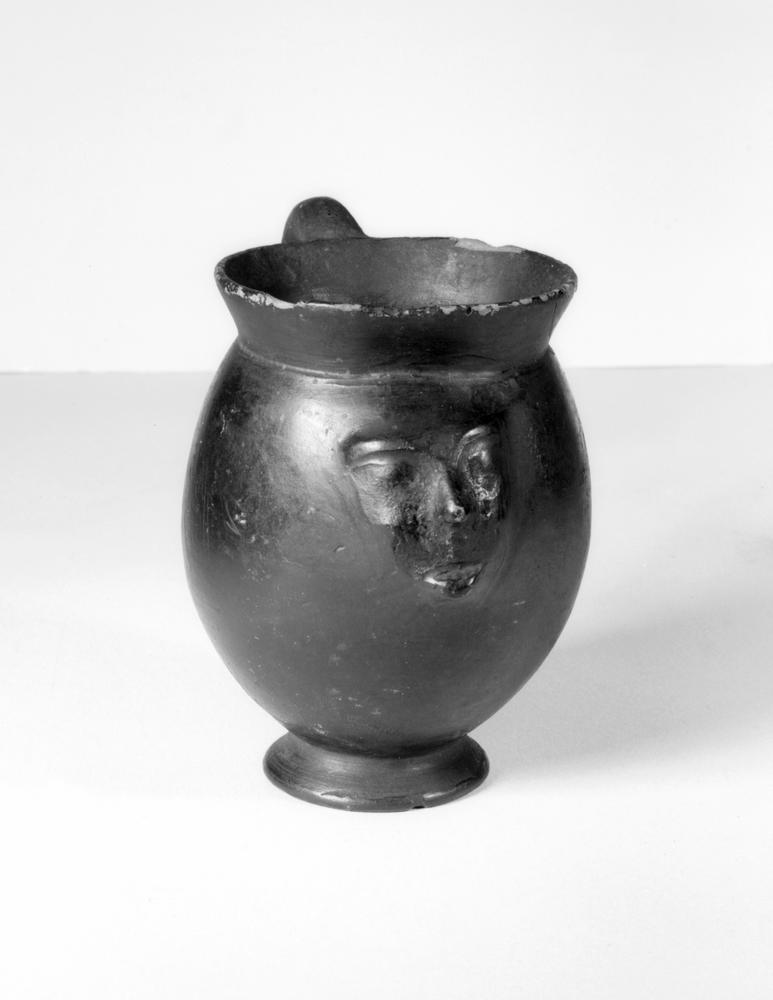 3 Early 6th-century BC bucchero face mug